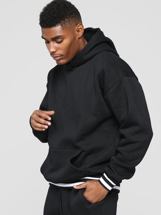 Men? Minimalistic Loose Pullover Hoodie With Front Pocket And A Stripped Hem