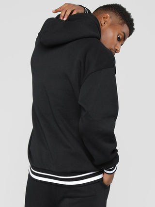 Men? Minimalistic Loose Pullover Hoodie With Front Pocket And A Stripped Hem