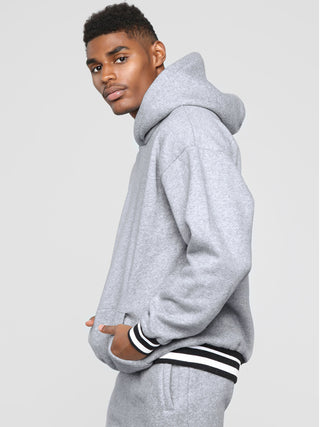 Men? Minimalistic Loose Pullover Hoodie With Front Pocket And A Stripped Hem